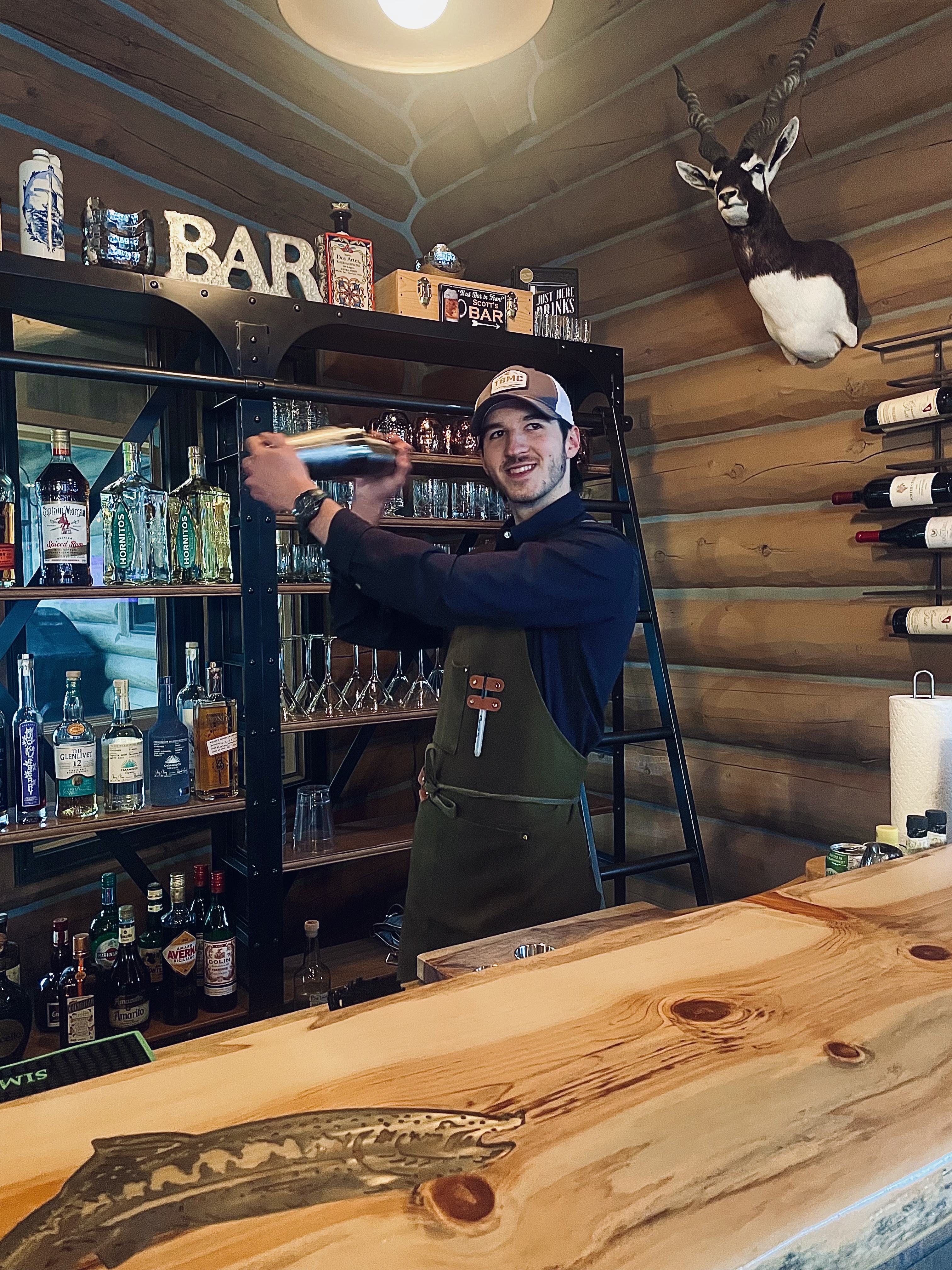 Bartender mixing drinks at the lodge bar