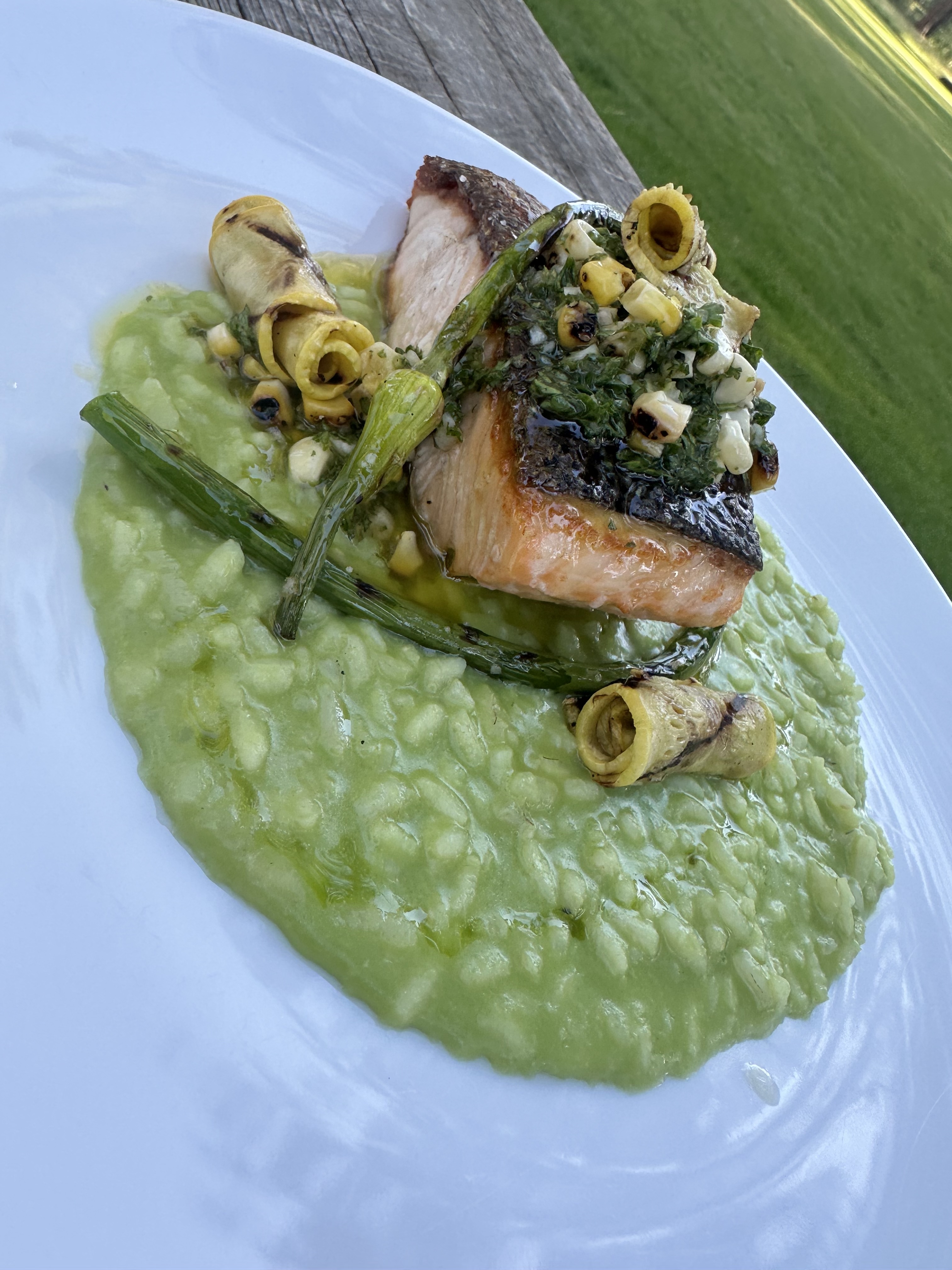 Pan-seared salmon with risotto prepared by the lodge chef
